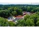 Aerial view of the community tennis courts and pavilion, surrounded by trees at 3798 Kirkwood Nw Run, Kennesaw, GA 30144