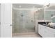 Modern bathroom featuring a glass-enclosed shower and vanity with black countertop at 4206 Townsend Ln, Atlanta, GA 30346