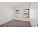 Neutral bedroom with two windows offering a view of the neighborhood at 4206 Townsend Ln, Atlanta, GA 30346