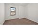 Empty room with carpet and one window at 4206 Townsend Ln, Atlanta, GA 30346