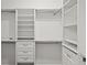 Custom-designed walk-in closet with adjustable shelving, drawers, and ample storage space for organization at 4206 Townsend Ln, Atlanta, GA 30346