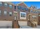 Charming brick townhome featuring a garage and steps leading to the front door with a classic and welcoming facade at 4206 Townsend Ln, Atlanta, GA 30346