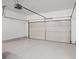 Clean, bright garage with a large door and epoxy flooring, providing ample space for parking and storage at 4206 Townsend Ln, Atlanta, GA 30346