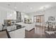 Modern kitchen with white cabinetry, granite countertops, stainless steel appliances, and an island with bar seating at 4206 Townsend Ln, Atlanta, GA 30346