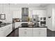 Modern kitchen with stainless steel appliances, black countertops, stylish backsplash, and a functional center island at 4206 Townsend Ln, Atlanta, GA 30346