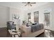 Inviting living room with white brick fireplace, dark floors and ample natural light at 4206 Townsend Ln, Atlanta, GA 30346