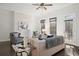 Bright living room featuring a stone fireplace, hardwood floors, and modern furnishings at 4206 Townsend Ln, Atlanta, GA 30346