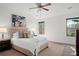 Bright main bedroom with a plush bed, neutral tones, and a ceiling fan at 4206 Townsend Ln, Atlanta, GA 30346