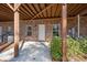 Covered patio with brick and wood structure, offering an outdoor space for relaxation or entertainment at 4206 Townsend Ln, Atlanta, GA 30346