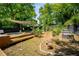Lush backyard with a hot tub, a garden area, and a well-maintained lawn, perfect for outdoor enjoyment at 1545 Montreat Sw Pl, Atlanta, GA 30311