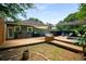 This backyard offers a wooden deck and a small pool, making it an ideal space for relaxation and outdoor entertainment at 1545 Montreat Sw Pl, Atlanta, GA 30311