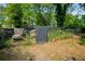 The backyard includes a fenced area with chicken coop, adding a touch of rustic charm to the property at 1545 Montreat Sw Pl, Atlanta, GA 30311