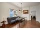 Bright dining room features modern lighting, hardwood floors, and built in bench seating at 1545 Montreat Sw Pl, Atlanta, GA 30311