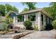 Charming bungalow featuring a quaint front porch, lush landscaping, and a welcoming curb appeal at 1545 Montreat Sw Pl, Atlanta, GA 30311