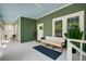 Relaxing front porch with comfortable seating, a ceiling fan, and a tranquil view of the outdoors at 1545 Montreat Sw Pl, Atlanta, GA 30311