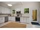Well-lit kitchen boasts stainless steel appliances, and plenty of cabinet space at 1545 Montreat Sw Pl, Atlanta, GA 30311