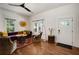 Stylish living room with hardwood floors, ample natural light, and comfortable seating for entertaining guests at 1545 Montreat Sw Pl, Atlanta, GA 30311