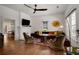 Bright living area features an ornate fireplace, hardwood floors, and comfortable seating for relaxation and socializing at 1545 Montreat Sw Pl, Atlanta, GA 30311