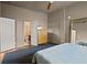 Spacious bedroom boasts a large mirror, ceiling fan and ensuite bathroom at 1545 Montreat Sw Pl, Atlanta, GA 30311