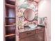 Stylish bathroom with tropical wallpaper, modern vanity, and unique mirror at 170 Boulevard Se # 521H, Atlanta, GA 30312