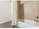 Well lit bathroom with a clean bathtub with modern, stylish tilework and fixtures at 170 Boulevard Se # 521H, Atlanta, GA 30312