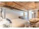 Bedroom with wooden ceiling and decorative lounge chair, a dresser and bed at 170 Boulevard Se # 521H, Atlanta, GA 30312