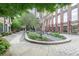 Beautiful courtyard featuring manicured greenery, stone walkways and seating areas, perfect for relaxation and community gatherings at 170 Boulevard Se # 521H, Atlanta, GA 30312