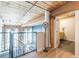 View from loft space overlooks a living room area with hardwood flooring at 170 Boulevard Se # 521H, Atlanta, GA 30312