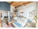 Open living area with exposed brick, spiral staircase, modern furnishings, and lots of natural light at 170 Boulevard Se # 521H, Atlanta, GA 30312