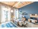 Inviting living room with large windows, exposed brick, wood ceilings and modern decor at 170 Boulevard Se # 521H, Atlanta, GA 30312