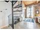 Bright living room with spiral staircase, wood beams, large windows, and modern décor at 170 Boulevard Se # 521H, Atlanta, GA 30312