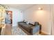 Modern living room with sofa and access to bathroom with decorative wallpaper at 170 Boulevard Se # 521H, Atlanta, GA 30312