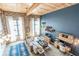 Bright living room with exposed brick, high wood ceilings, modern furnishings and large windows at 170 Boulevard Se # 521H, Atlanta, GA 30312
