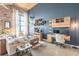Spacious living room with a comfortable sofa, modern furniture, and exposed brick wall at 170 Boulevard Se # 521H, Atlanta, GA 30312