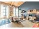 Bright living room featuring high ceilings, exposed brick, and a cozy seating area with modern furnishings at 170 Boulevard Se # 521H, Atlanta, GA 30312