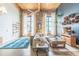 Bright living room with exposed brick, high ceilings, modern furnishings, and large windows at 170 Boulevard Se # 521H, Atlanta, GA 30312