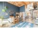 Bright open-concept living room with high ceilings, modern décor, and spiral staircase to upper level at 170 Boulevard Se # 521H, Atlanta, GA 30312
