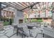 Cozy outdoor fireplace with comfortable seating, perfect for relaxing evenings in a stylish and inviting setting at 170 Boulevard Se # 521H, Atlanta, GA 30312