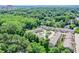 Aerial view of community with manicured lawns, lush trees, pool and conveniently located near city at 2187 Elmont Se Way, Smyrna, GA 30080