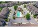 An aerial view of a neighborhood with a swimming pool and townhome-style condos with well-maintained landscaping at 2187 Elmont Se Way, Smyrna, GA 30080