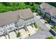 Overhead view of townhomes with brick and painted siding in a lush community at 2187 Elmont Se Way, Smyrna, GA 30080