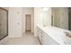 Modern bathroom features a double vanity, granite countertop, and tile flooring at 2187 Elmont Se Way, Smyrna, GA 30080