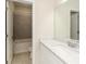 Bright bathroom featuring a white vanity with marble countertop and a large mirror, complemented by a bathtub-shower combo at 2187 Elmont Se Way, Smyrna, GA 30080