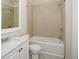Bathroom featuring a tiled shower/tub, a toilet, and a vanity with a marble countertop and silver faucet at 2187 Elmont Se Way, Smyrna, GA 30080