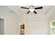 Bedroom with tray ceilings, ceiling fan, and access to en suite bathroom at 2187 Elmont Se Way, Smyrna, GA 30080
