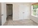 Bedroom features closet and window with open door and view of hall at 2187 Elmont Se Way, Smyrna, GA 30080