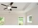 Bright bedroom featuring a modern ceiling fan, two windows, and neutral walls at 2187 Elmont Se Way, Smyrna, GA 30080