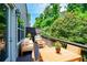 Inviting deck with full outdoor furniture seating, ideal for relaxing and enjoying the outdoor view at 2187 Elmont Se Way, Smyrna, GA 30080