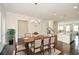 Bright dining room featuring wood table, chandelier lighting, and hardwood floors at 2187 Elmont Se Way, Smyrna, GA 30080