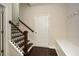 Entryway with staircase, coat hooks, a bench, and access to lower level at 2187 Elmont Se Way, Smyrna, GA 30080